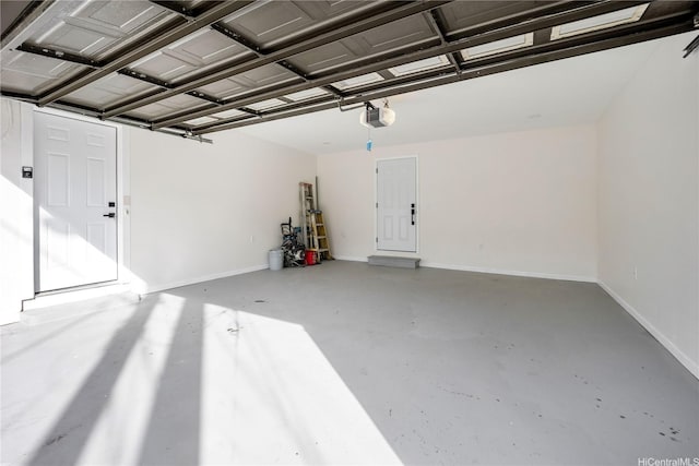 1849 Vancouver Pl, Honolulu, HI 96822 - garage with baseboards and a garage door opener