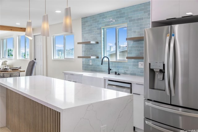 1849 Vancouver Pl, Honolulu, HI 96822 - kitchen featuring a sink, decorative backsplash, modern cabinets, white cabinetry, and appliances with stainless steel finishes