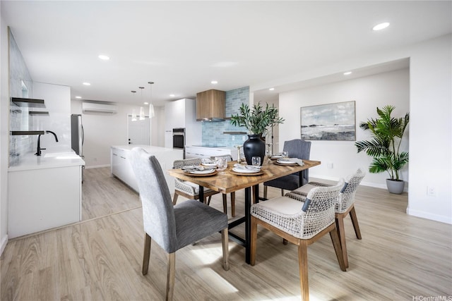 1849 Vancouver Pl, Honolulu, HI 96822 - dining room featuring light wood-type flooring, baseboards, recessed lighting, and a wall mounted air conditioner