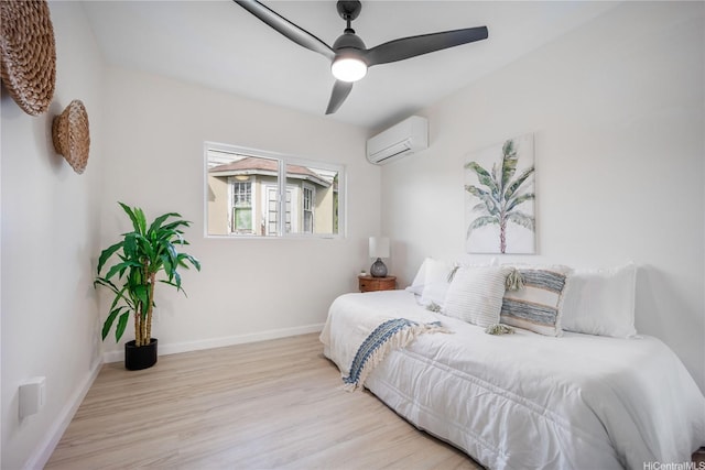 1849 Vancouver Pl, Honolulu, HI 96822 - bedroom featuring a wall mounted air conditioner, baseboards, a ceiling fan, and wood finished floors