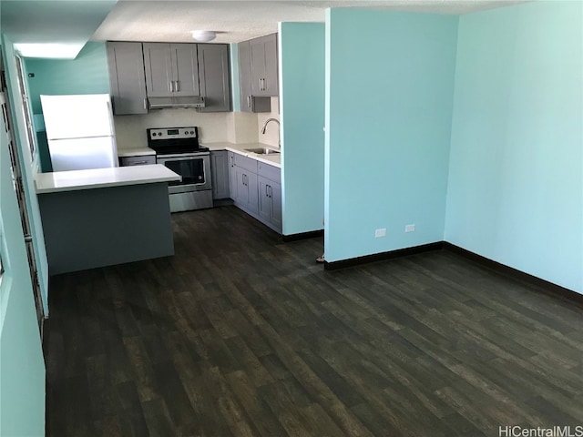 kitchen with stainless steel electric range, white fridge, dark wood-type flooring, and gray cabinetry