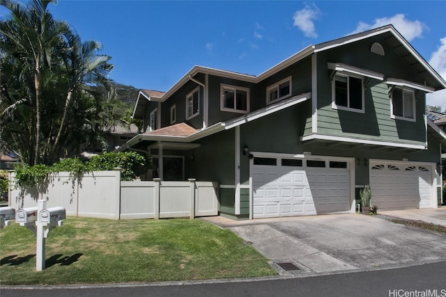 view of front of house featuring a front lawn and a garage