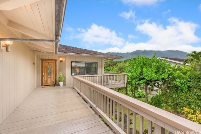 wooden deck featuring a mountain view