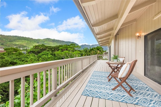 balcony featuring a mountain view