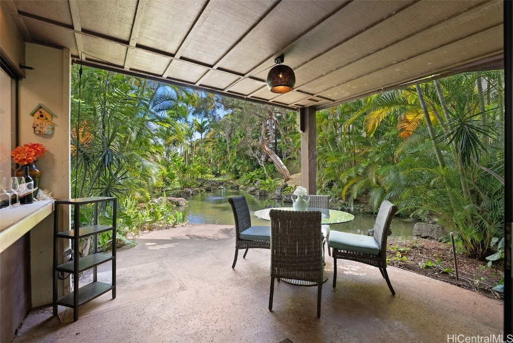 view of patio featuring a water view