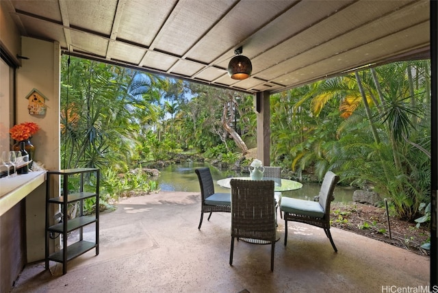 view of patio featuring a water view