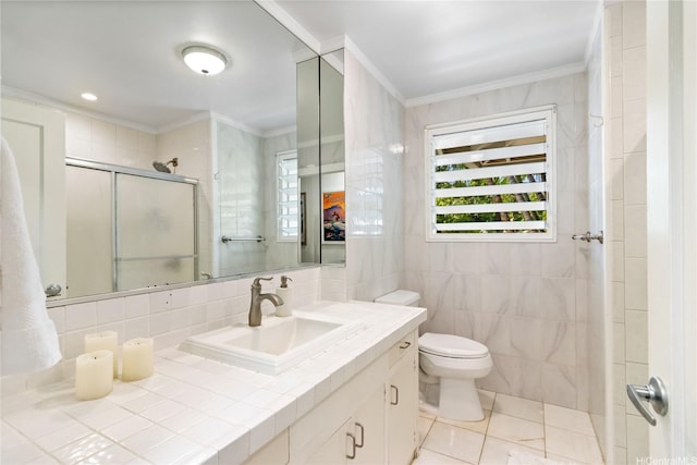 61-707 Papailoa Rd, Haleiwa, HI 96712 - bathroom featuring a stall shower, tile walls, ornamental molding, toilet, and vanity