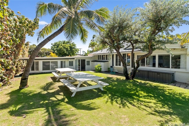 back of house with a yard