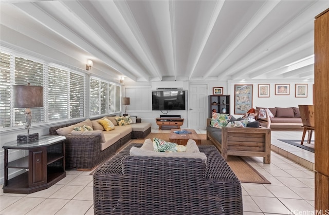 tiled living room with beam ceiling