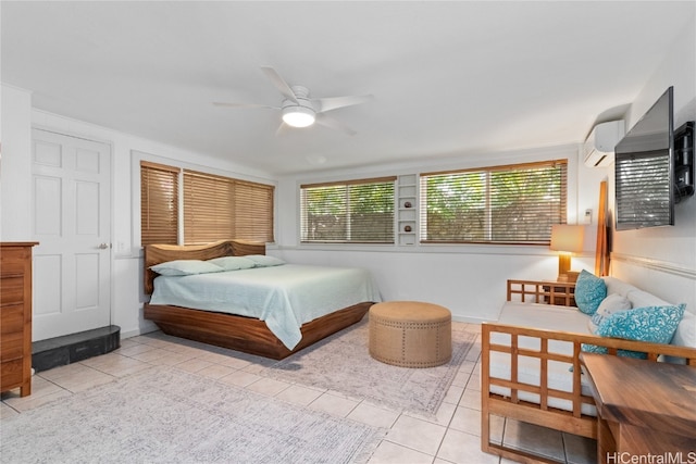 tiled bedroom with a wall mounted AC and ceiling fan