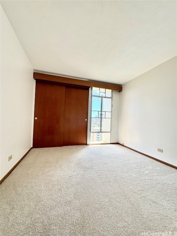 unfurnished bedroom with carpet flooring