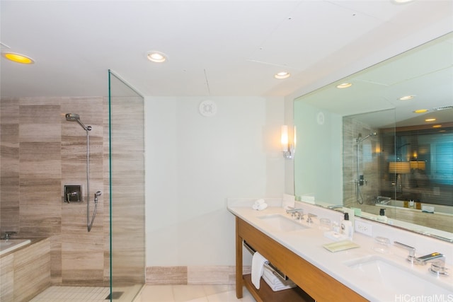 bathroom featuring vanity, independent shower and bath, and tile patterned flooring