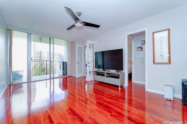 living room with french doors, a wall of windows, wood-type flooring, and ceiling fan