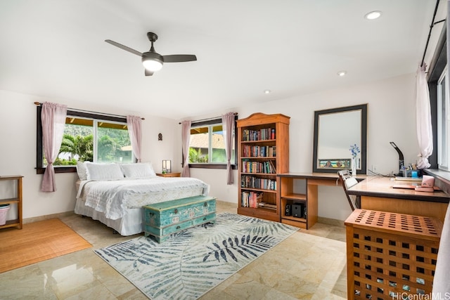 bedroom featuring built in desk and ceiling fan