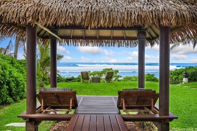 exterior space with a gazebo, a water view, and a jacuzzi