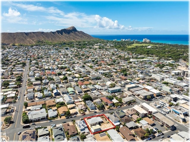 drone / aerial view with a water and mountain view