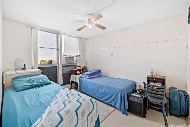 bedroom featuring a textured ceiling and ceiling fan