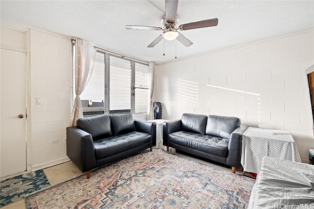 living room featuring a textured ceiling and ceiling fan