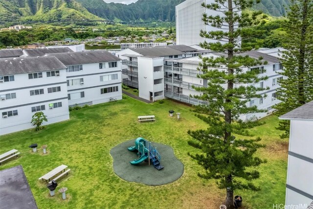 birds eye view of property with a mountain view