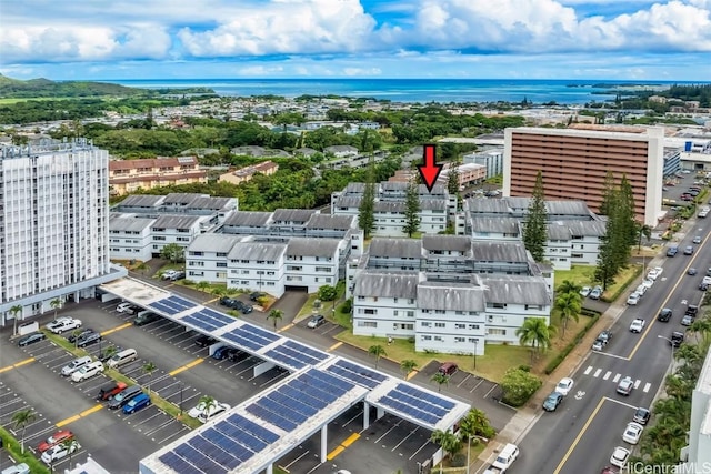 birds eye view of property with a water view