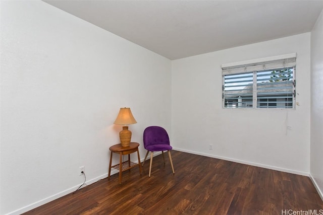 unfurnished room with dark wood-type flooring