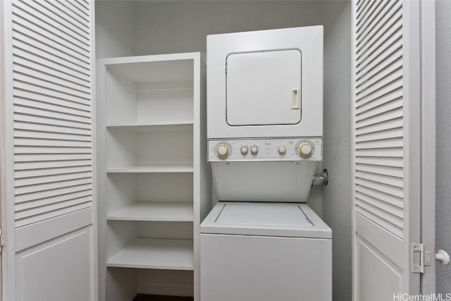 washroom with stacked washer and clothes dryer