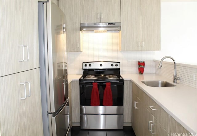 kitchen with backsplash, light brown cabinets, sink, and stainless steel appliances