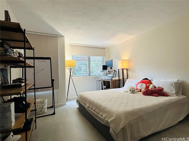 bedroom featuring light colored carpet