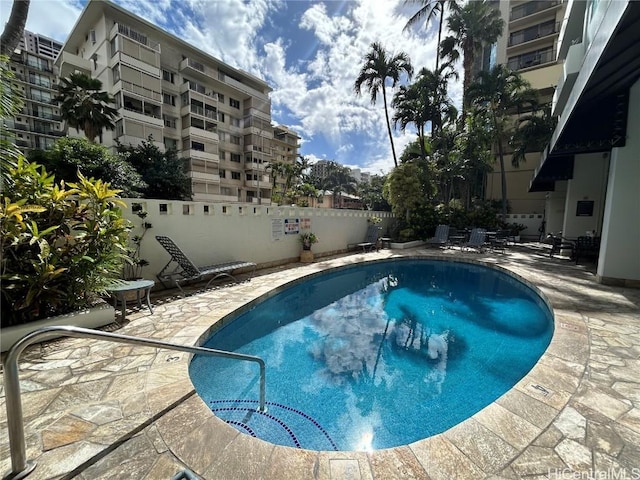 view of swimming pool with a patio area