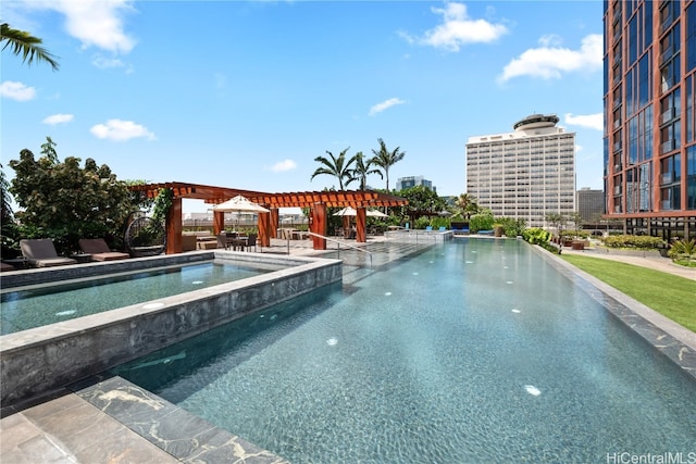 view of pool featuring a pergola, a patio area, and a jacuzzi