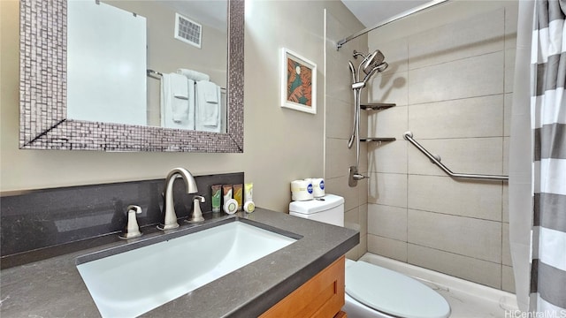 bathroom featuring vanity, toilet, and a shower with curtain