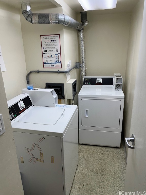 laundry room featuring washing machine and clothes dryer