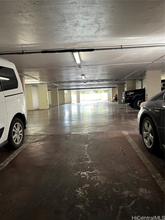 garage featuring a carport