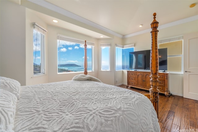 bedroom with hardwood / wood-style flooring and ornamental molding