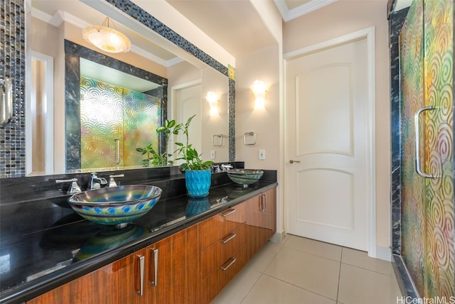 bathroom featuring vanity, crown molding, and tile patterned flooring