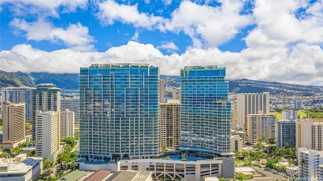 property's view of city with a mountain view