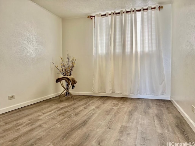 unfurnished room featuring hardwood / wood-style floors