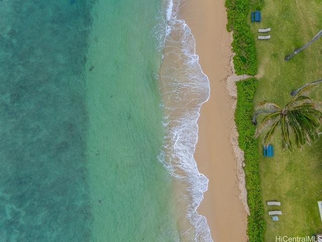 drone / aerial view featuring a water view and a beach view