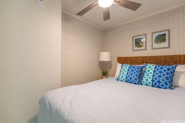 bedroom featuring ornamental molding and ceiling fan