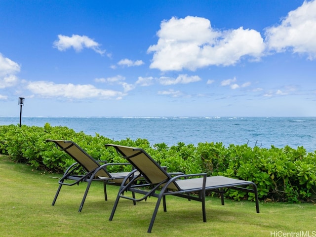 exterior space with a water view and a yard