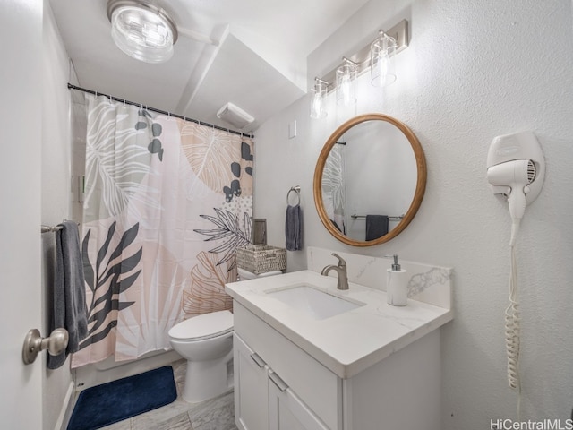 bathroom featuring vanity, toilet, and a shower with shower curtain