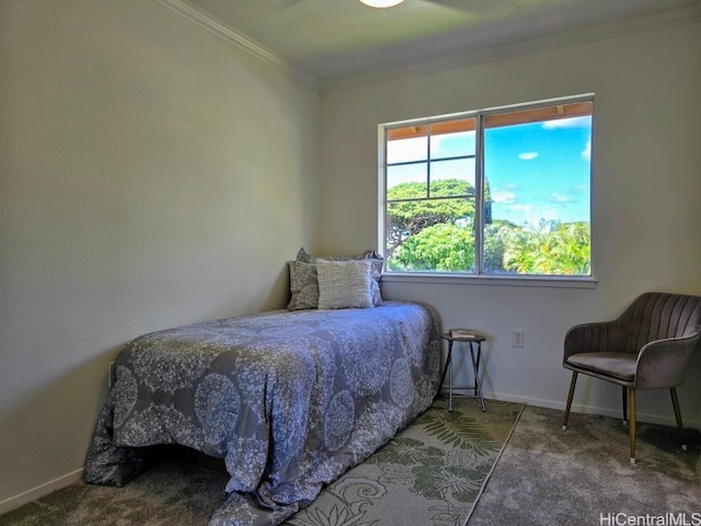 bedroom featuring carpet, ornamental molding, and ceiling fan