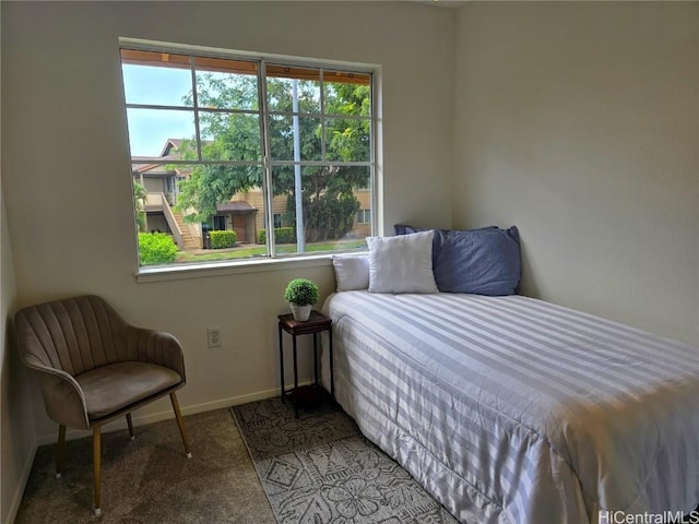 carpeted bedroom with baseboards