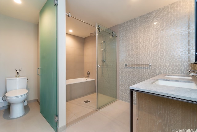 full bathroom featuring vanity, toilet, tile walls, and plus walk in shower