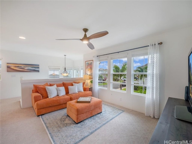 carpeted living room featuring ceiling fan