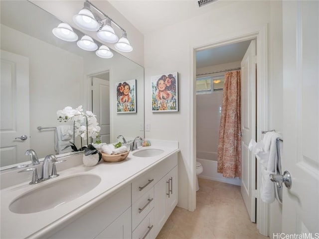 full bathroom with shower / bathtub combination with curtain, vanity, tile patterned floors, and toilet