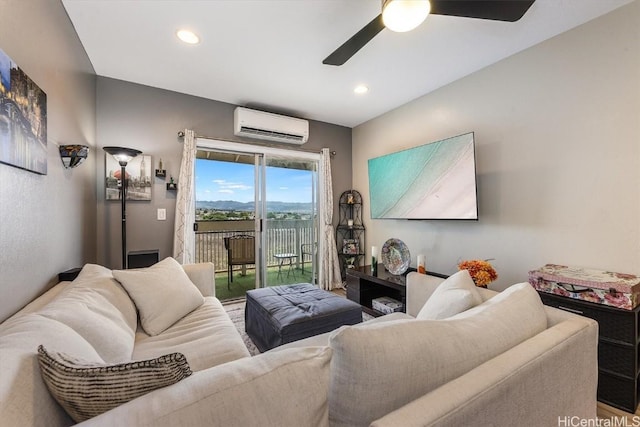 living room featuring ceiling fan and an AC wall unit