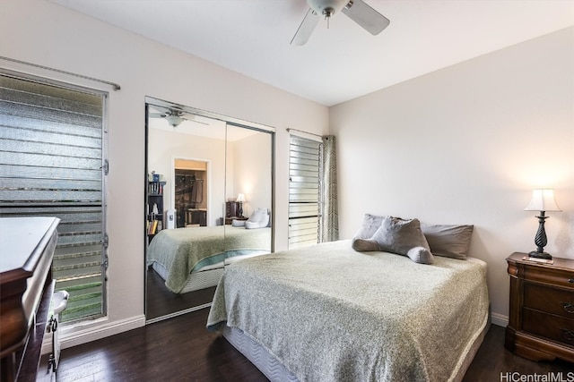 bedroom with ceiling fan, a closet, and dark wood-type flooring