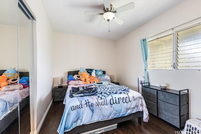 bedroom with a closet, ceiling fan, and dark hardwood / wood-style flooring