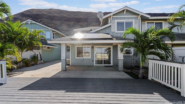 exterior space with a deck with mountain view